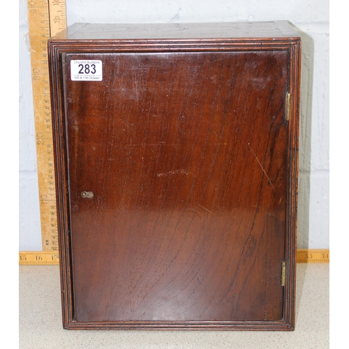 283 - A vintage mahogany wall cabinet