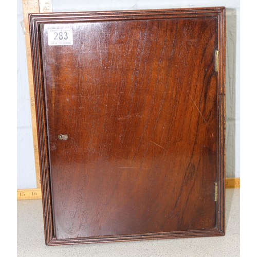 283 - A vintage mahogany wall cabinet