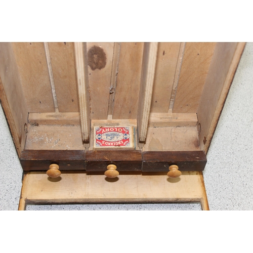 286 - A vintage homemade wooden matchbox dispensing machine with key, c.1930's