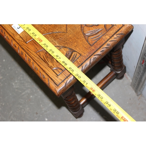 3 - A 17th century style oak low table or stool with carved details and bobbin turned legs