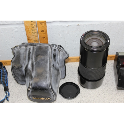 655 - A Minolta 7000 camera in bag with various lenses and accessories