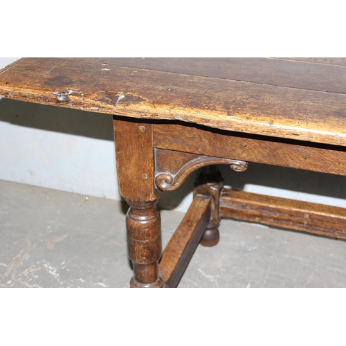 7 - An antique oak or elm 5 plank topped refectory table with turned legs, carved brackets and peg joint... 