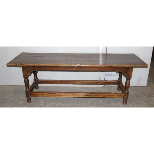 7 - An antique oak or elm 5 plank topped refectory table with turned legs, carved brackets and peg joint... 