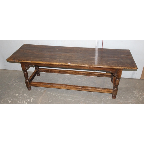 7 - An antique oak or elm 5 plank topped refectory table with turned legs, carved brackets and peg joint... 