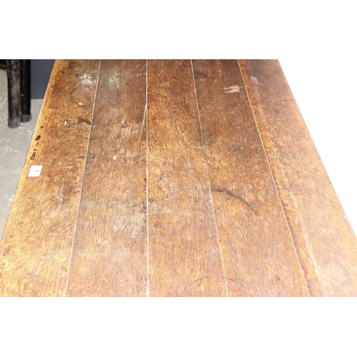 7 - An antique oak or elm 5 plank topped refectory table with turned legs, carved brackets and peg joint... 