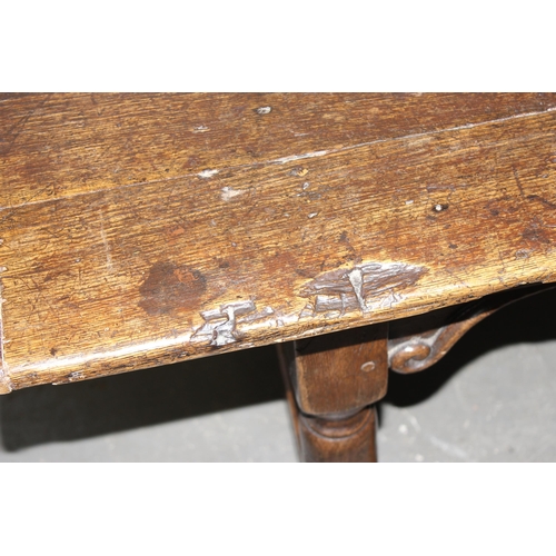 7 - An antique oak or elm 5 plank topped refectory table with turned legs, carved brackets and peg joint... 