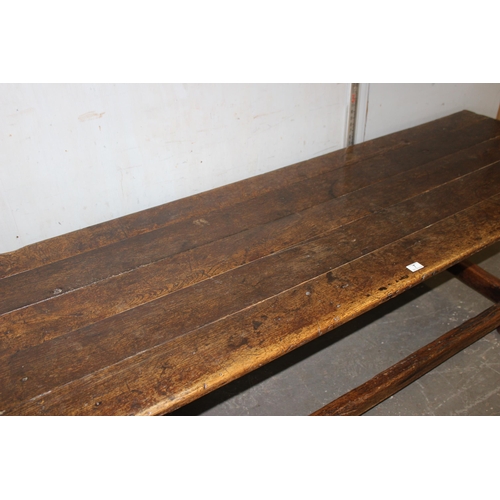 7 - An antique oak or elm 5 plank topped refectory table with turned legs, carved brackets and peg joint... 