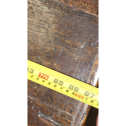 7 - An antique oak or elm 5 plank topped refectory table with turned legs, carved brackets and peg joint... 