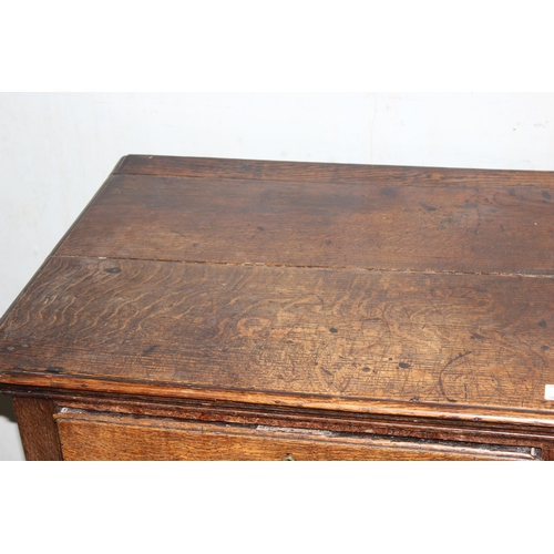 9 - An 18th century small oak sideboard with 2 deep drawers and brass handles, standing on cabriole legs... 