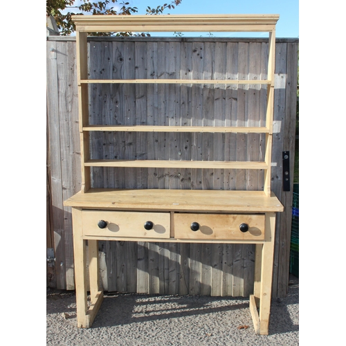 135 - A Victorian pine dresser with turned wooden handles, approx 145cm wide