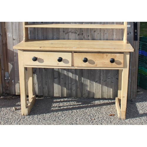 135 - A Victorian pine dresser with turned wooden handles, approx 145cm wide