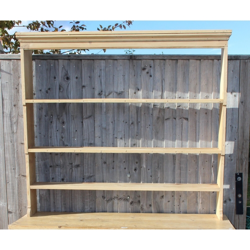 135 - A Victorian pine dresser with turned wooden handles, approx 145cm wide