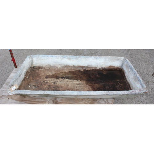 321 - A large lead lined sink with wooden carcass, approx 151cm x 75cm