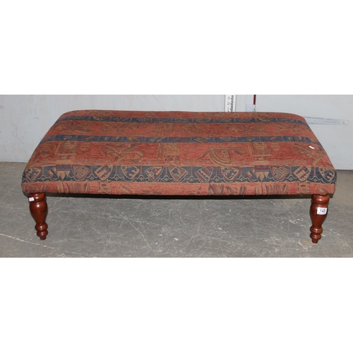 145 - A large ottoman or footstool with turned wooden legs