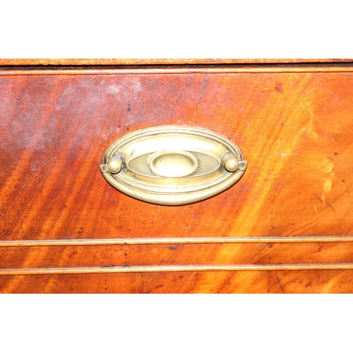 147 - A 19th century 4 drawer chest of drawers with brass handles, the top drawer being a secrétaire desk ... 