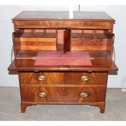 147 - A 19th century 4 drawer chest of drawers with brass handles, the top drawer being a secrétaire desk ... 