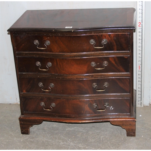 148 - A 20th century mahogany effect serpentine 4 drawer chest of drawers