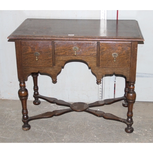 150 - A 17th century style oak lowboy with 3 drawers and X stretcher