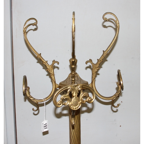 151 - A vintage brass coat stand decorated with female masks to the base