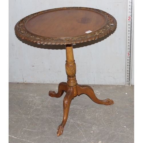 152 - An unusual vintage tilt top table with pierced carved details on tripod base