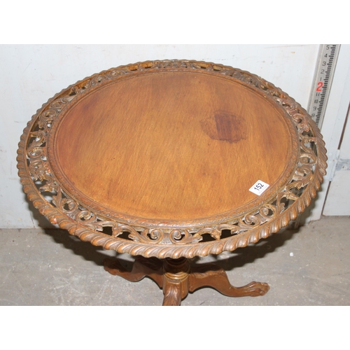 152 - An unusual vintage tilt top table with pierced carved details on tripod base