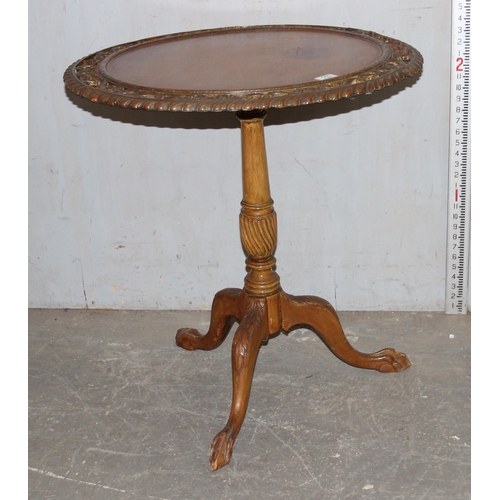 152 - An unusual vintage tilt top table with pierced carved details on tripod base