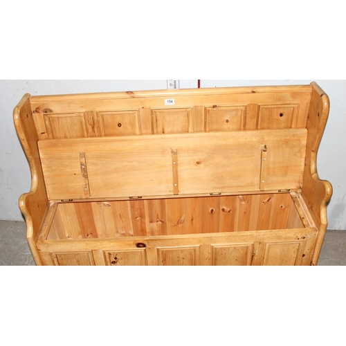 154 - A vintage pine settle bench with storage, approx 122cm wide