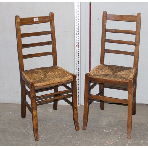 156 - A pair of Arts & Crafts period rushed seated bedroom chairs