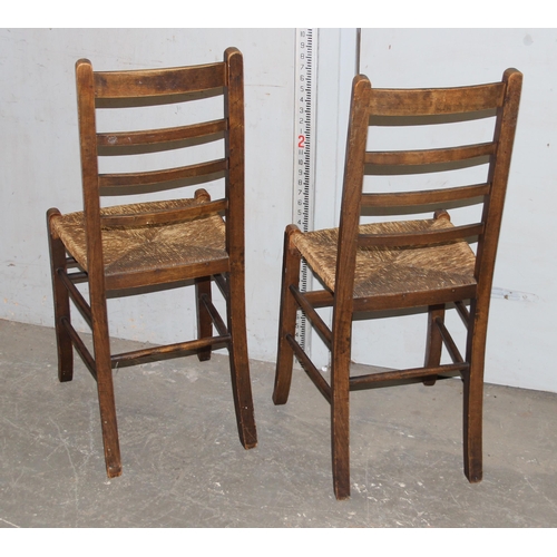 156 - A pair of Arts & Crafts period rushed seated bedroom chairs