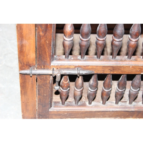 125 - Antique style cabinet with turned dowel birdcage type design