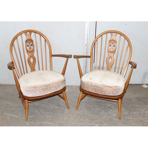 126 - A pair of Ercol Fleur de Lys armchairs with cushions