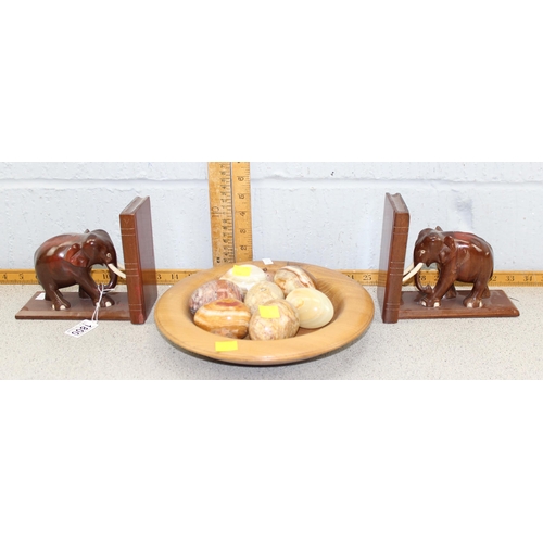 1800 - Bowl of polished stone eggs and a pair of carved wooden elephant bookends