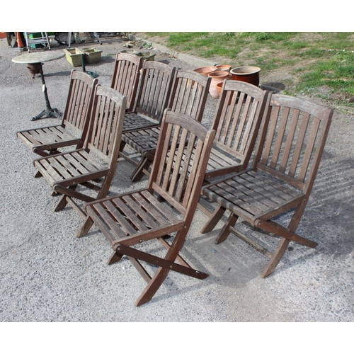 313 - 8 folding teak garden chairs