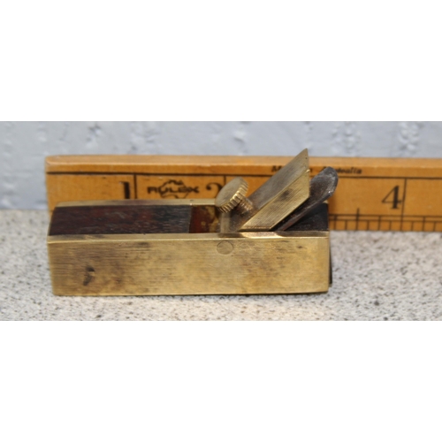 802 - Vintage brass Zippo lighter, well made brass wood plane, and a brass bell shaped measuring device