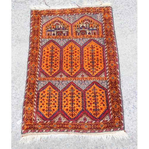 222 - A vintage hand knotted prayer rug of red and yellow ground, approx 138cm x 85cm