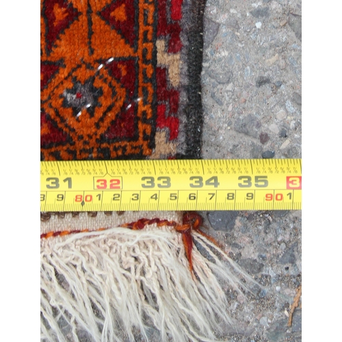 222 - A vintage hand knotted prayer rug of red and yellow ground, approx 138cm x 85cm