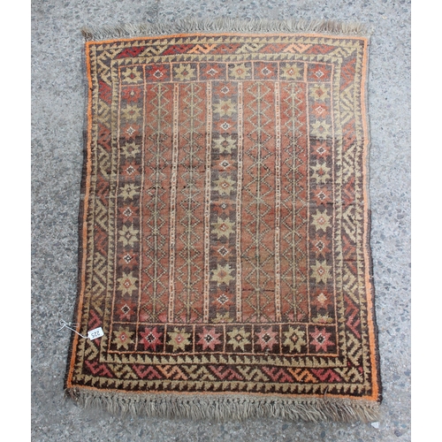 225 - An antique handmade rug, approx 117cm x 87cm