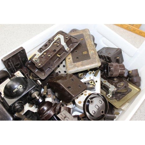 828 - Box full of mainly Bakelite light fittings & switches