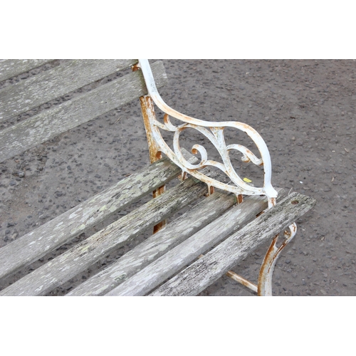 331 - A Victorian style wrought iron and wooden slatted garden bench