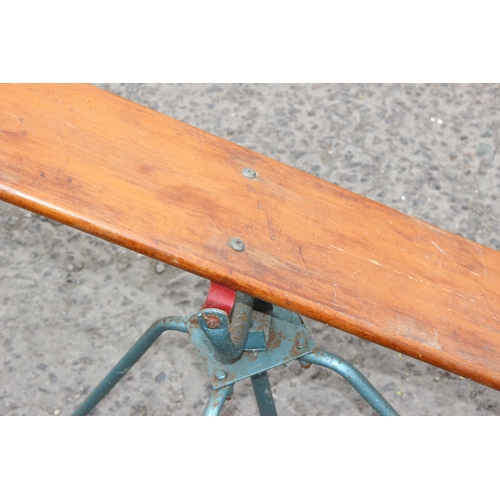 336 - A vintage wooden and metal based children's seesaw