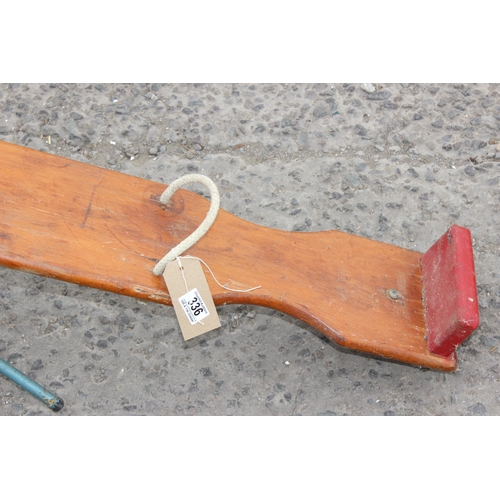 336 - A vintage wooden and metal based children's seesaw