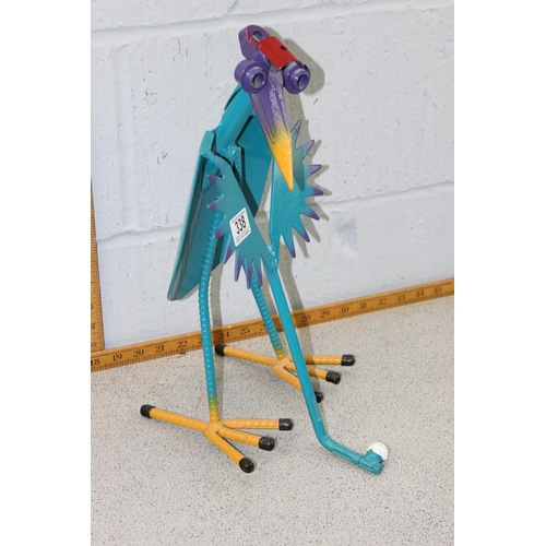 338 - A garden model of a bird playing golf, made from various garden implements and painted