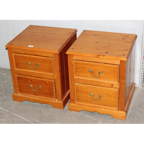 39 - A pair of pine 2 drawer bedside cabinets with brass drop handles