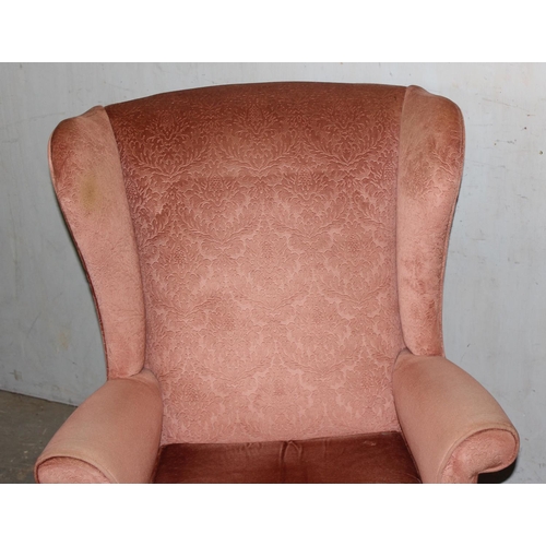 41 - A pair of Parker Knoll model 720 wingback armchairs