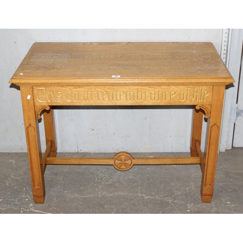 55 - A vintage light oak side table with gilt gothic script and carved Templar cross to base, likely from... 