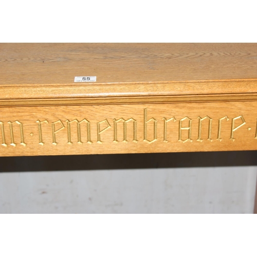 55 - A vintage light oak side table with gilt gothic script and carved Templar cross to base, likely from... 