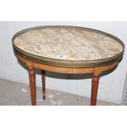 61 - A French Bouillotte table with marble top and brass gallery standing on fluted legs, likely 20th cen... 