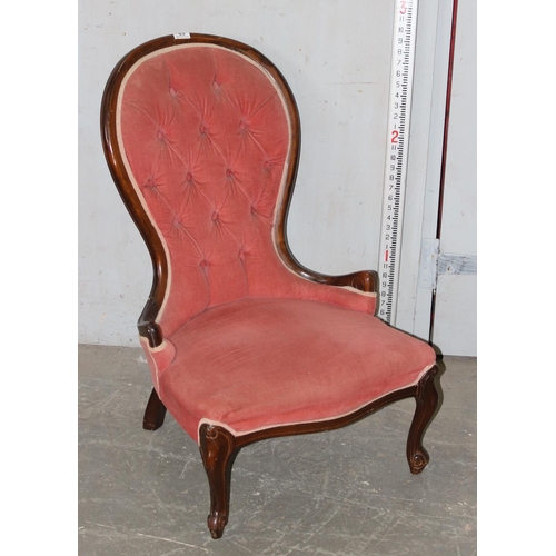 63 - A vintage pink upholstered button backed nursing chair with mahogany frame