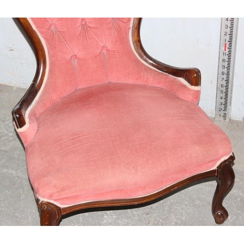 63 - A vintage pink upholstered button backed nursing chair with mahogany frame