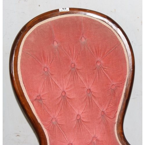 63 - A vintage pink upholstered button backed nursing chair with mahogany frame